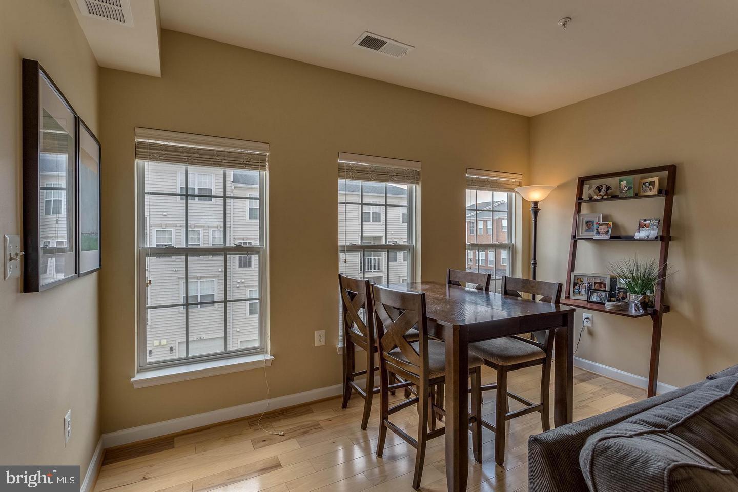14233 B St Germain Drive, Unit 6 Centreville, VA 20121 - Photo 7 of 13 a view of a dining room with furniture and window