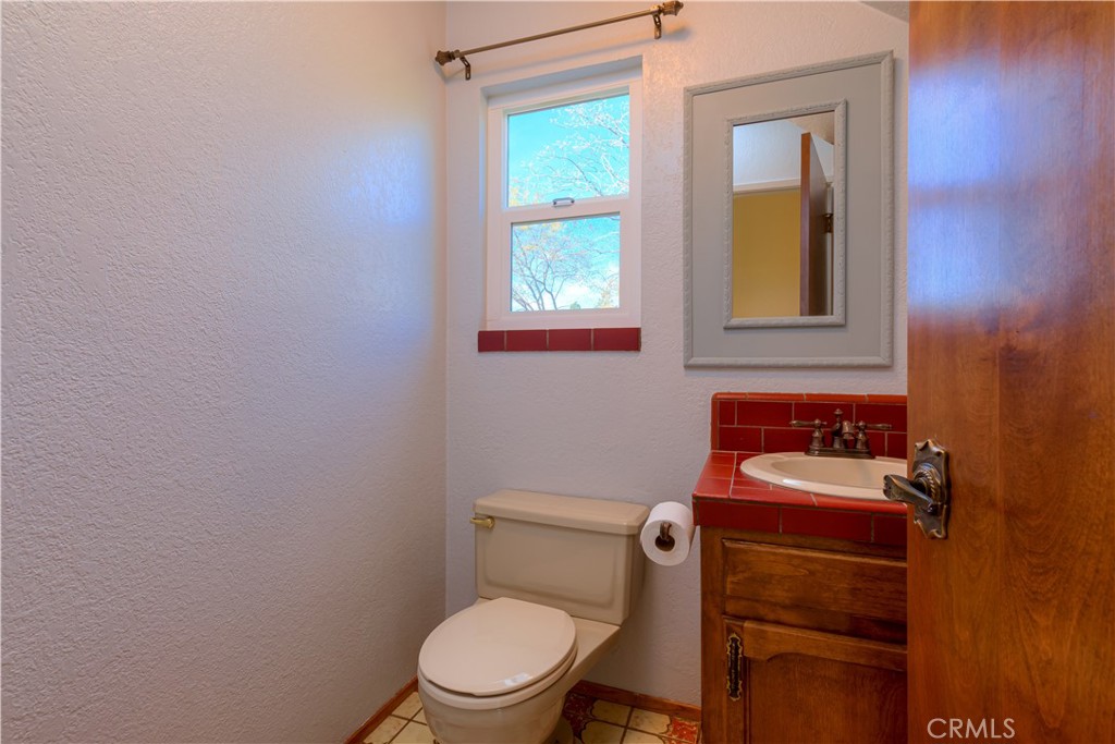 217 Craft Paradise, CA 95969 - Photo 16 of 62 a bathroom with a toilet a sink and mirror