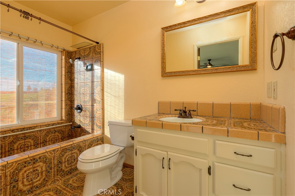 217 Craft Paradise, CA 95969 - Photo 21 of 62 a bathroom with a sink a toilet and a mirror
