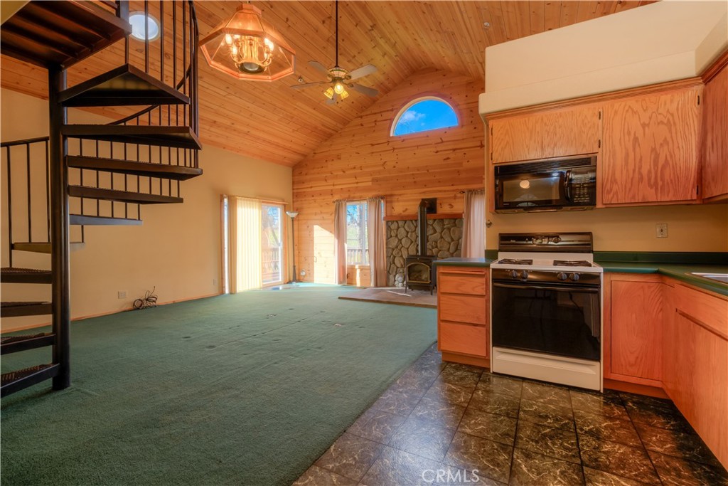 217 Craft Paradise, CA 95969 - Photo 34 of 62 a kitchen with stainless steel appliances granite countertop a stove a sink and a microwave