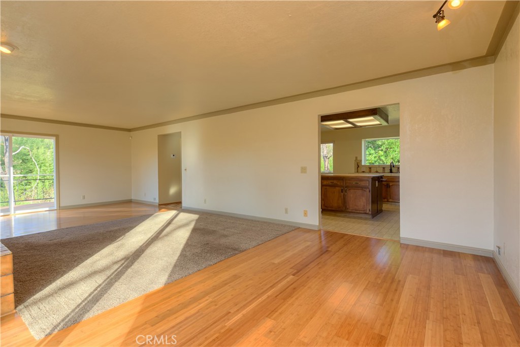 217 Craft Paradise, CA 95969 - Photo 7 of 62 a view of empty room with wooden floor and fan
