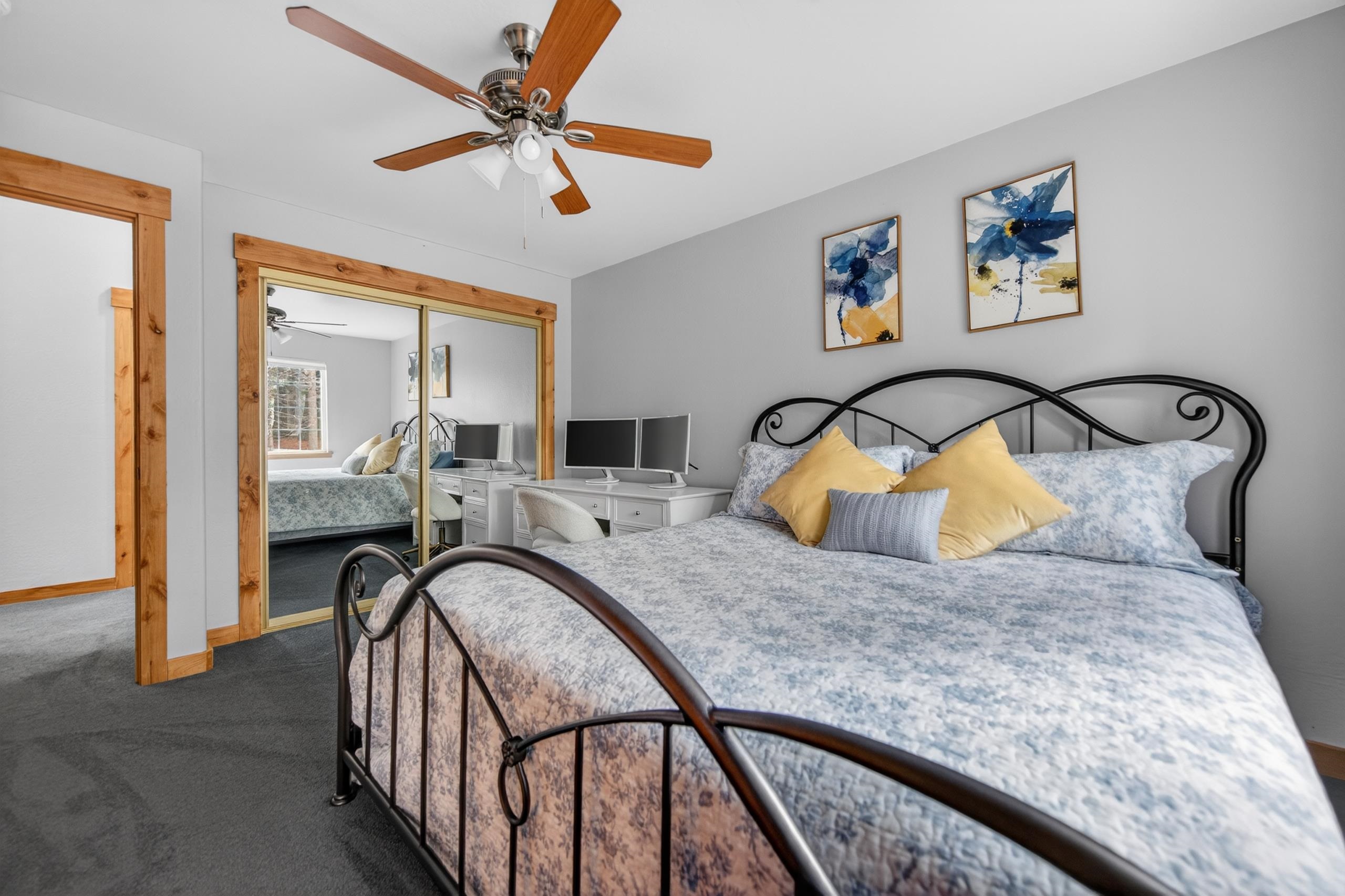 1220 Lynx Road Lake Almanor, CA 96137 - Photo 20 of 45 a bedroom with a bed and a chandelier