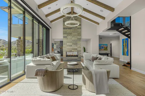a kitchen with white cabinets and sink