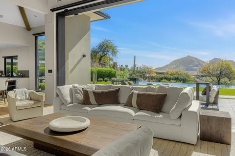 a kitchen with a table chairs sink and cabinets
