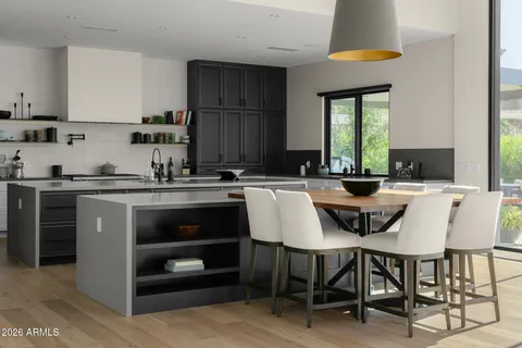 a living room with furniture and a lamp