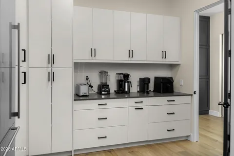 a view of bathroom with a sink and mirror