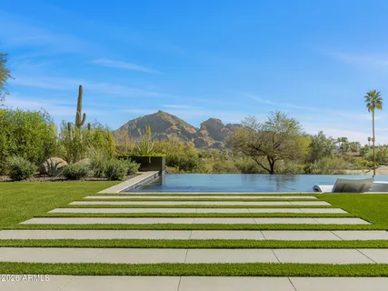 a dining room with furniture and a chandelier
