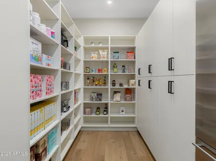 a room with pool table and windows