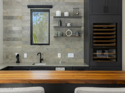 a living room with furniture a flat screen tv and a window