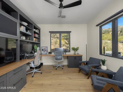 a spacious bedroom with a large bed and a window