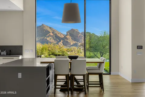 a kitchen with a sink stove top oven and cabinets