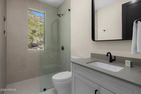 a kitchen with stainless steel appliances a sink stove and cabinets