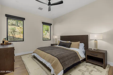 a balcony with furniture and a floor to ceiling window