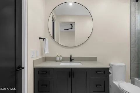 a kitchen with a table chairs and a refrigerator