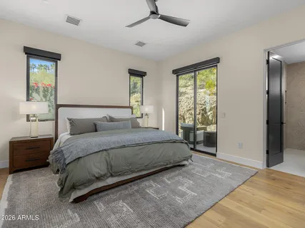a view of a house with brick walls and potted plants