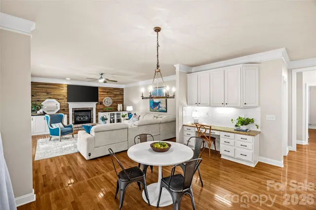 a living room with fireplace furniture and a window