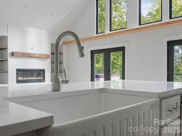 a view of a fireplace with a large window