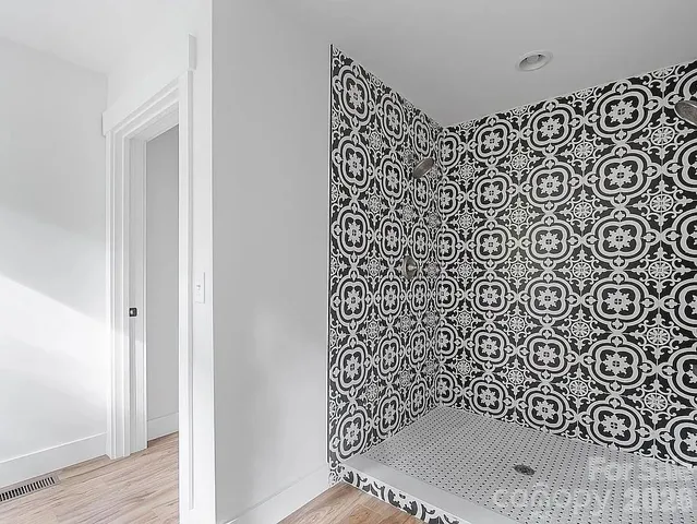 a bathroom with a shower curtain