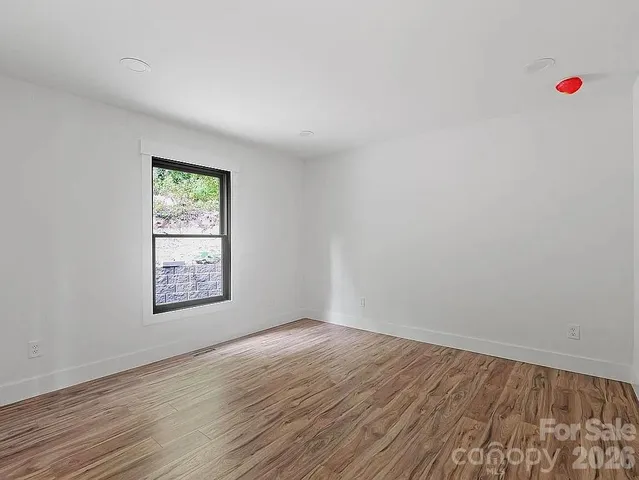 a view of an empty room and window