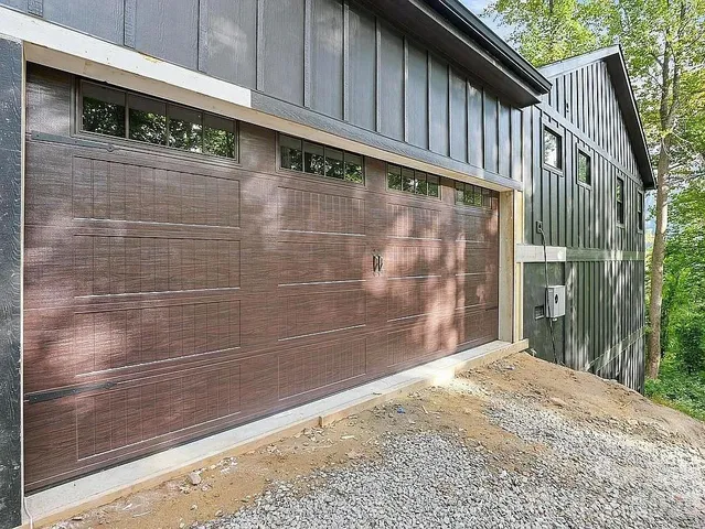 a view of a wooden door with a bench