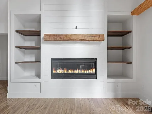 a view of a fireplace with wooden floor