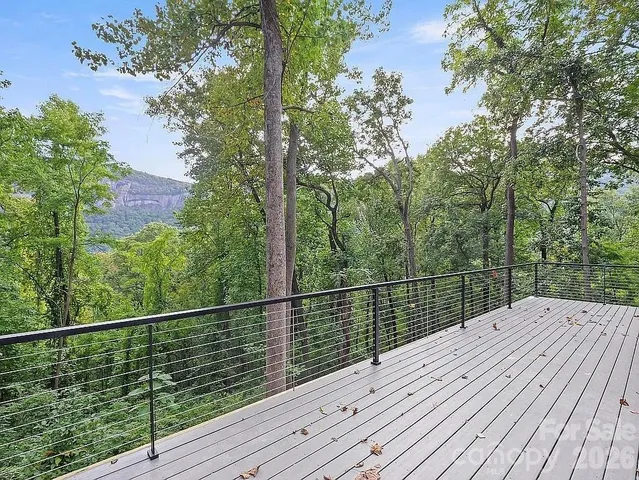 a view of balcony with wooden floor