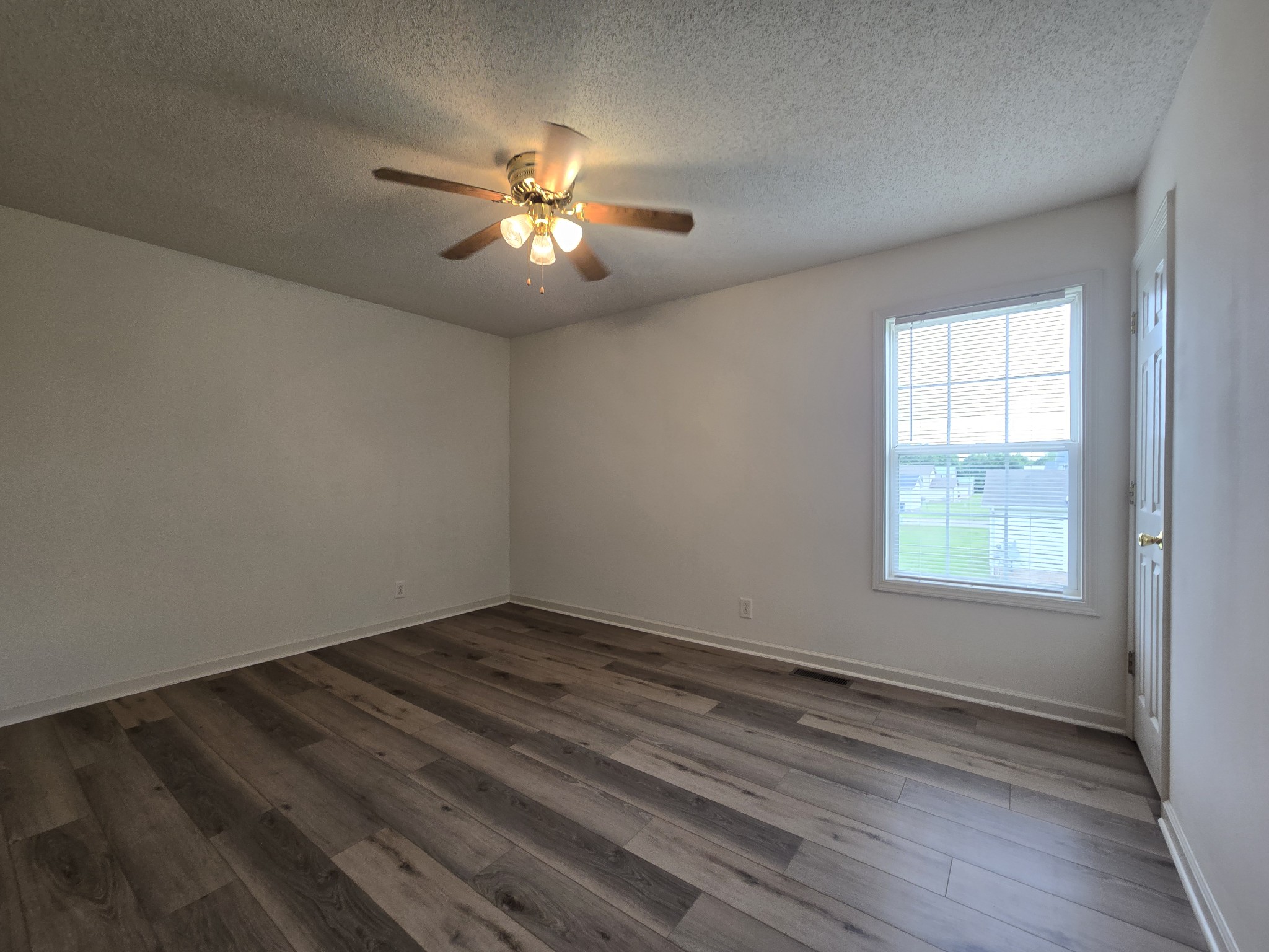 237 State Line Road Oak Grove, KY 42262 - Photo 20 of 20 wooden floor in an empty room with a window