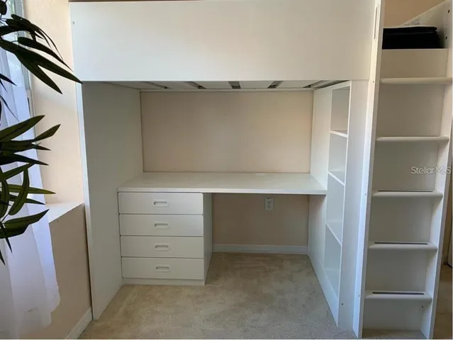 a view of an empty walk in closet