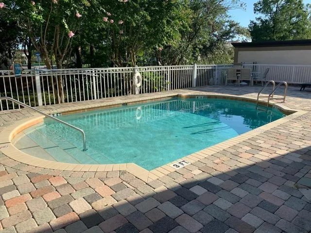 a view of a backyard with a small pool