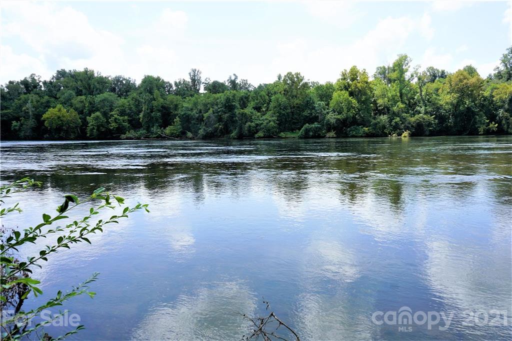 a view of a lake with a yard