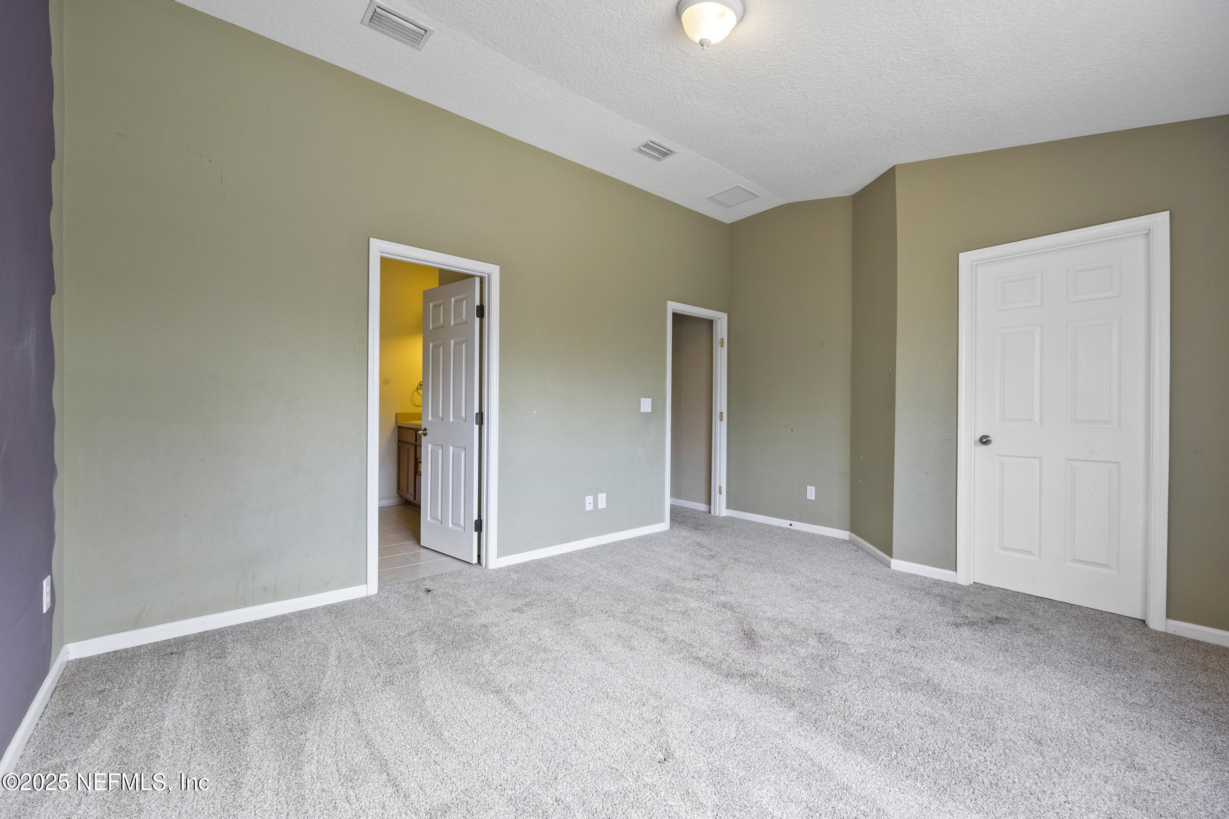 13309 Solar Drive Jacksonville, FL 32258 - Photo 15 of 29 an empty room with closet and wooden floor