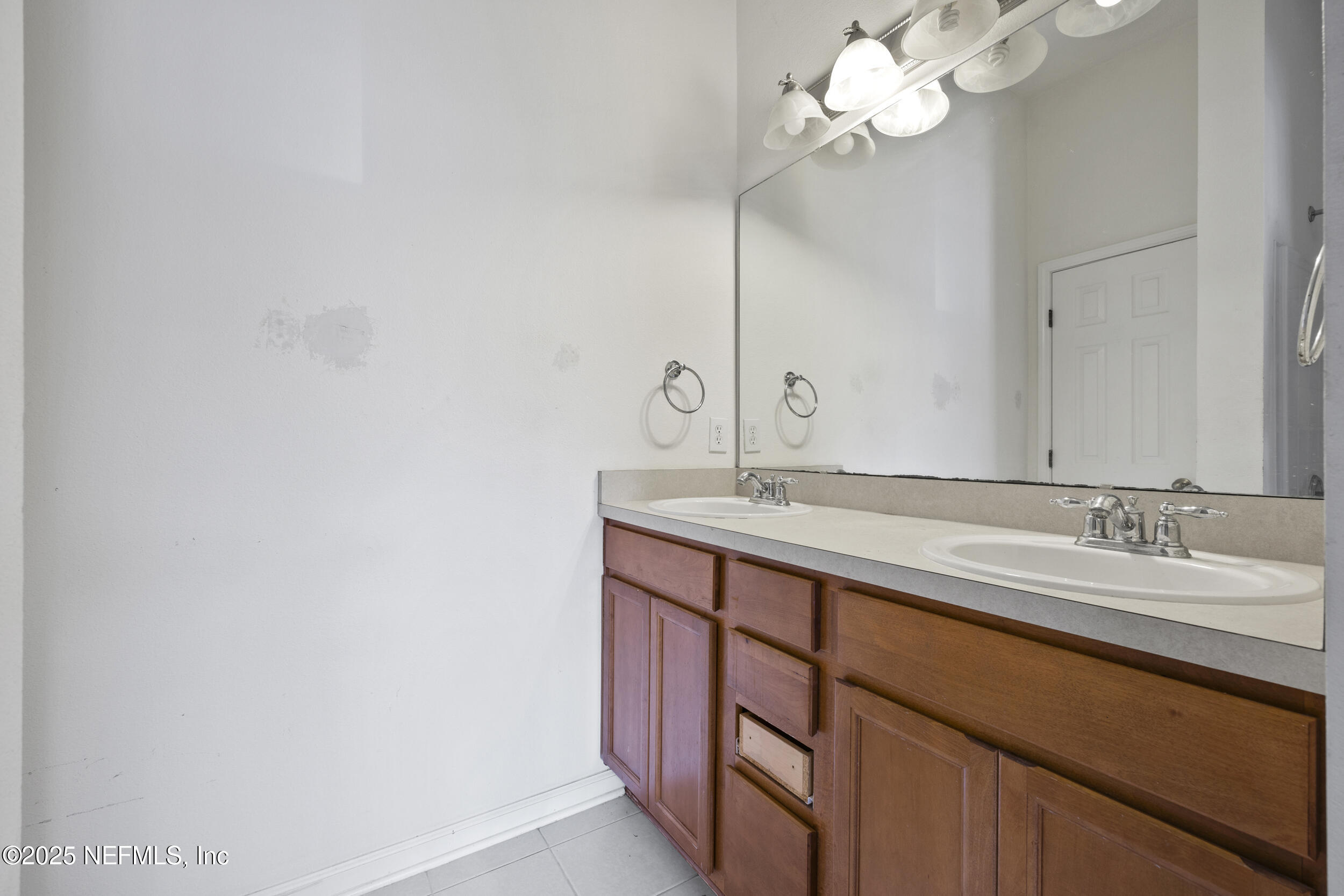 13309 Solar Drive Jacksonville, FL 32258 - Photo 16 of 29 a bathroom with a sink a mirror and vanity
