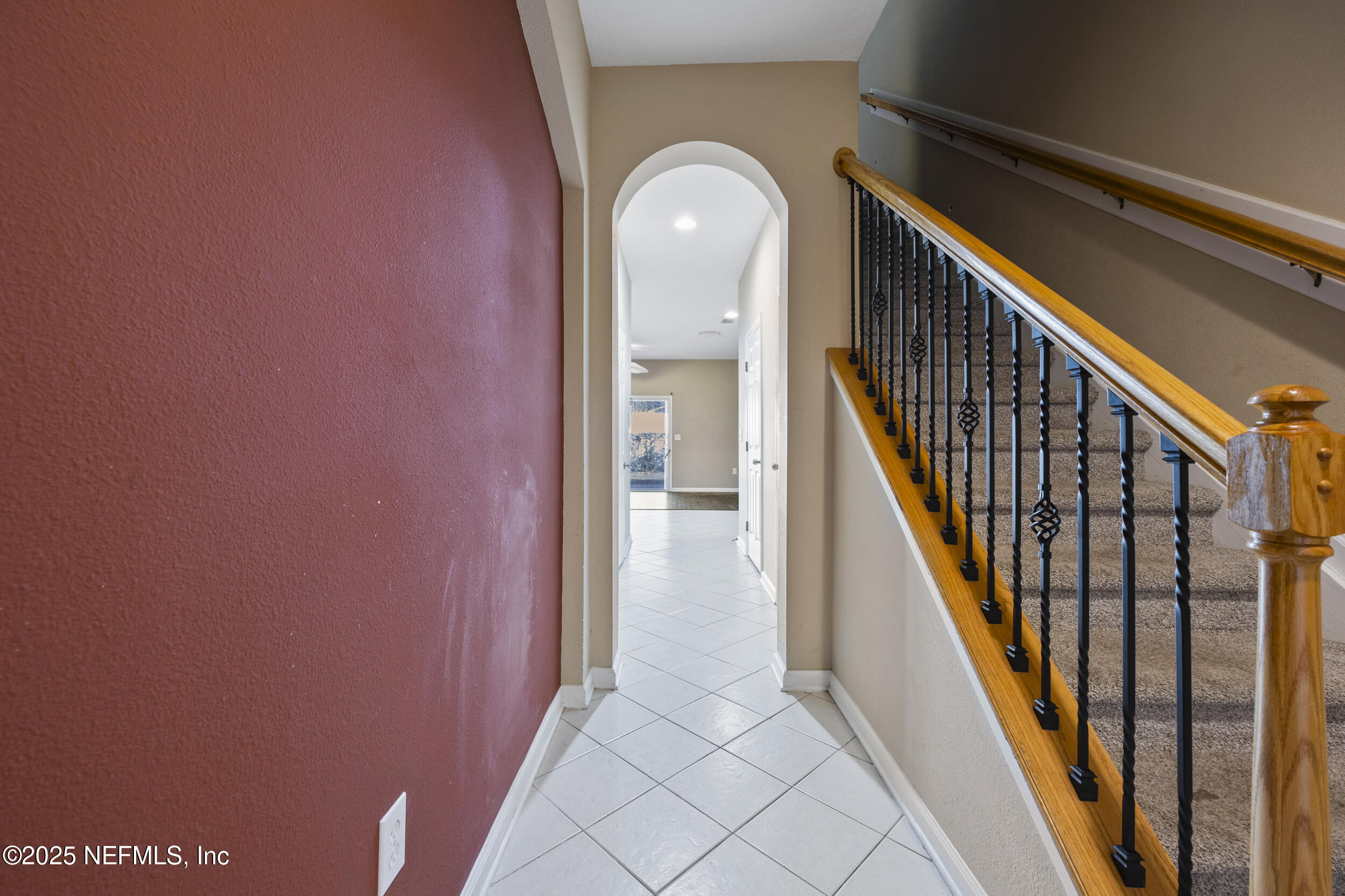 13309 Solar Drive Jacksonville, FL 32258 - Photo 3 of 29 a view of a hallway with wooden floor and staircase