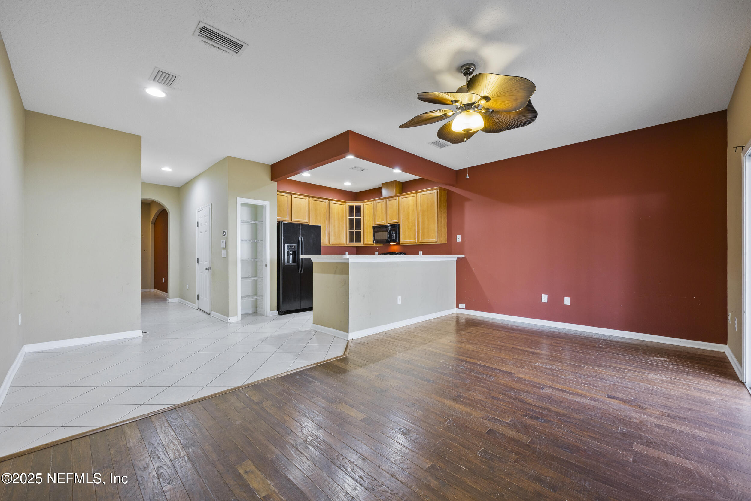 13309 Solar Drive Jacksonville, FL 32258 - Photo 5 of 29 a view of a kitchen with a sink and a refrigerator