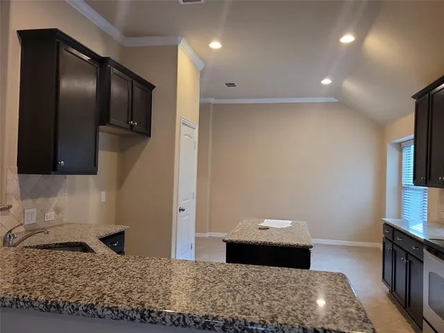 a fireplace with a hallway