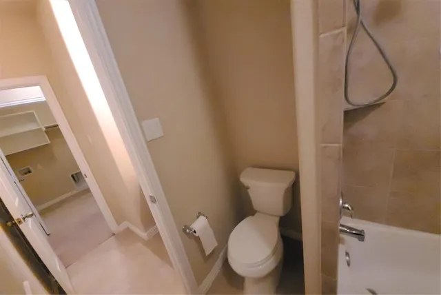 a bathroom with a bathtub and a sink