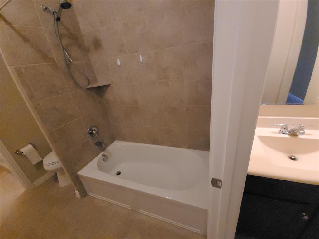 11821 Beach Street Frisco, TX 75036 - Photo 28 of 38 Bathroom featuring vanity and tub / shower combination