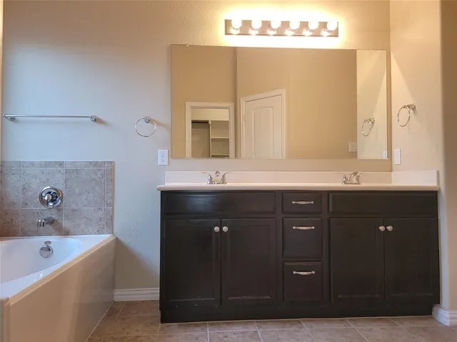 a view of kitchen with sink microwave and refrigerator