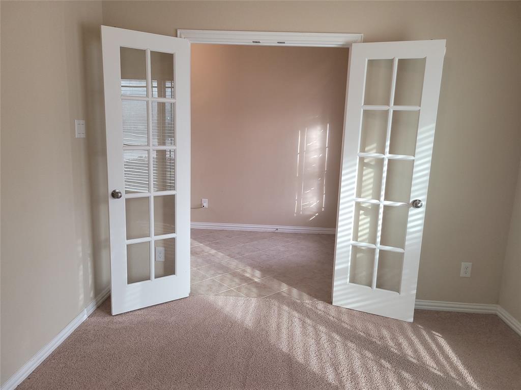 11821 Beach Street Frisco, TX 75036 - Photo 36 of 38 Unfurnished room with light carpet and light tile patterned floors