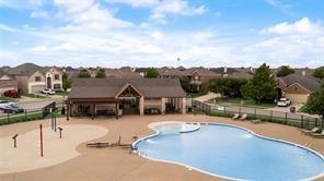 11821 Beach Street Frisco, TX 75036 - Photo 4 of 38 an aerial view of a house with swimming pool and mountains