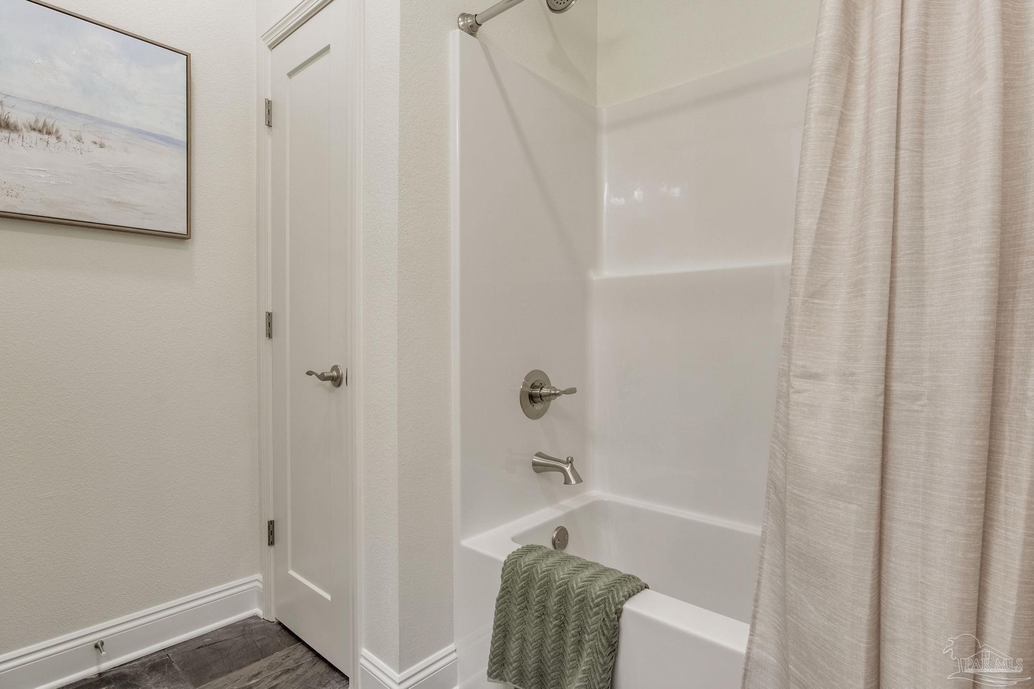 4404 Russell Elliott Road Jay, FL 32565 - Photo 42 of 62 a bathroom with a bathtub and shower