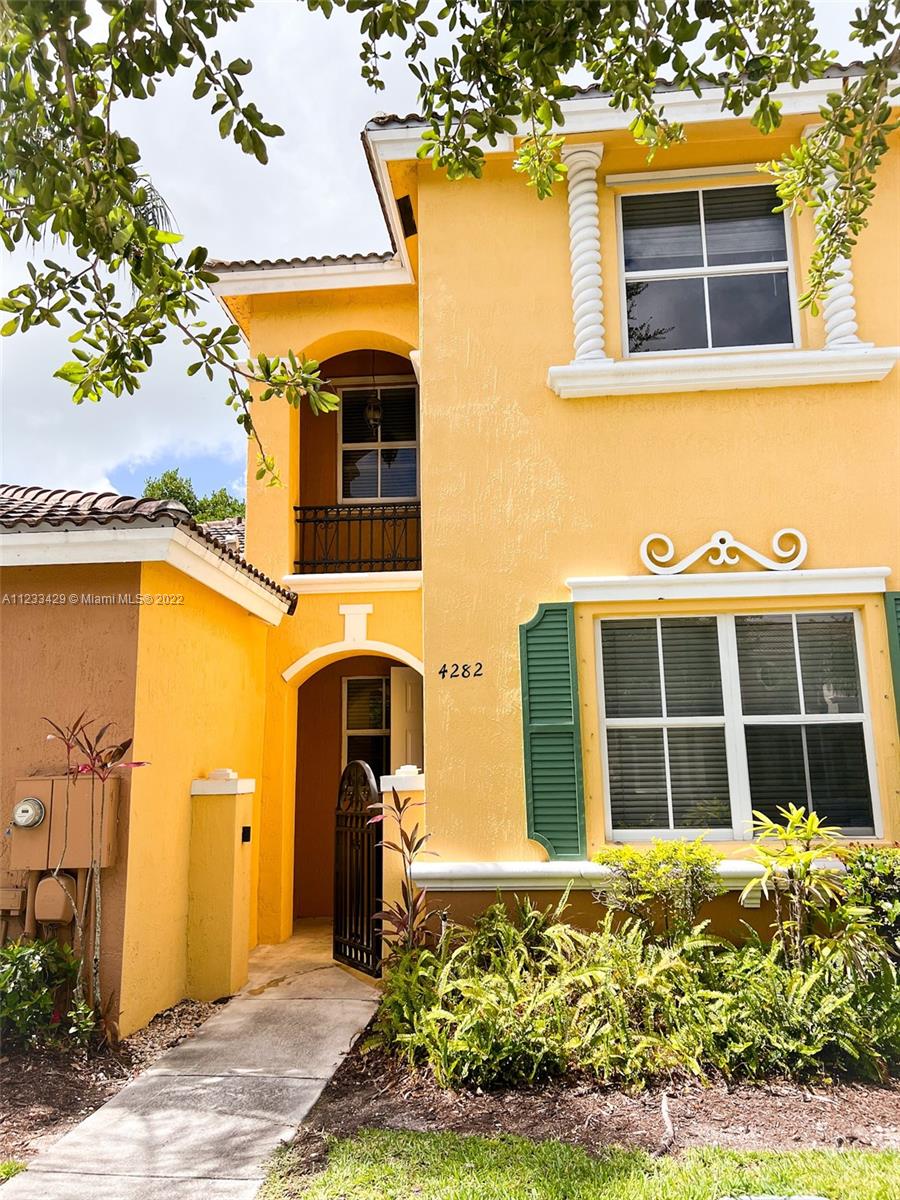 4282 Northeast 9th Street, Unit 4282 Homestead, FL 33033 - Photo 1 of 28 a front view of a house having yard