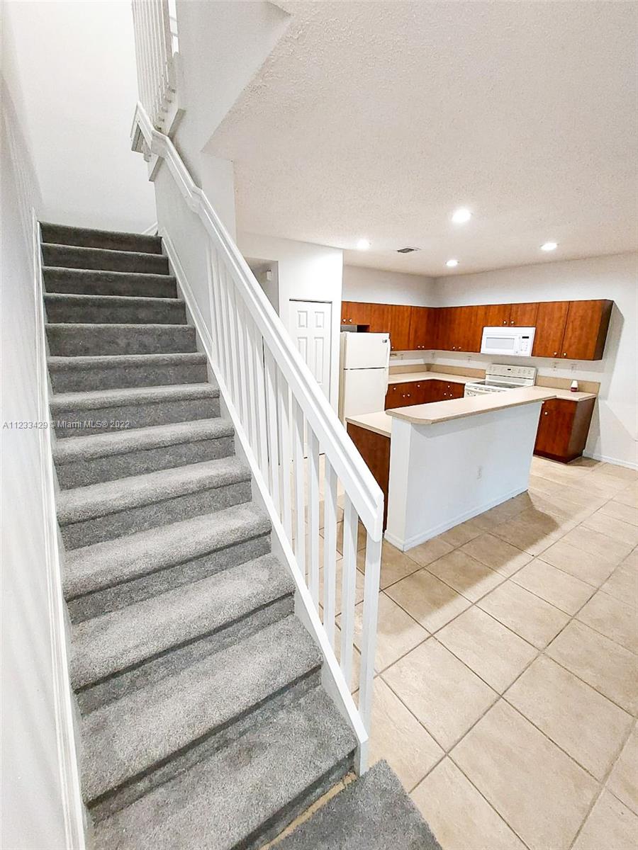 4282 Northeast 9th Street, Unit 4282 Homestead, FL 33033 - Photo 13 of 28 a view of entryway and kitchen