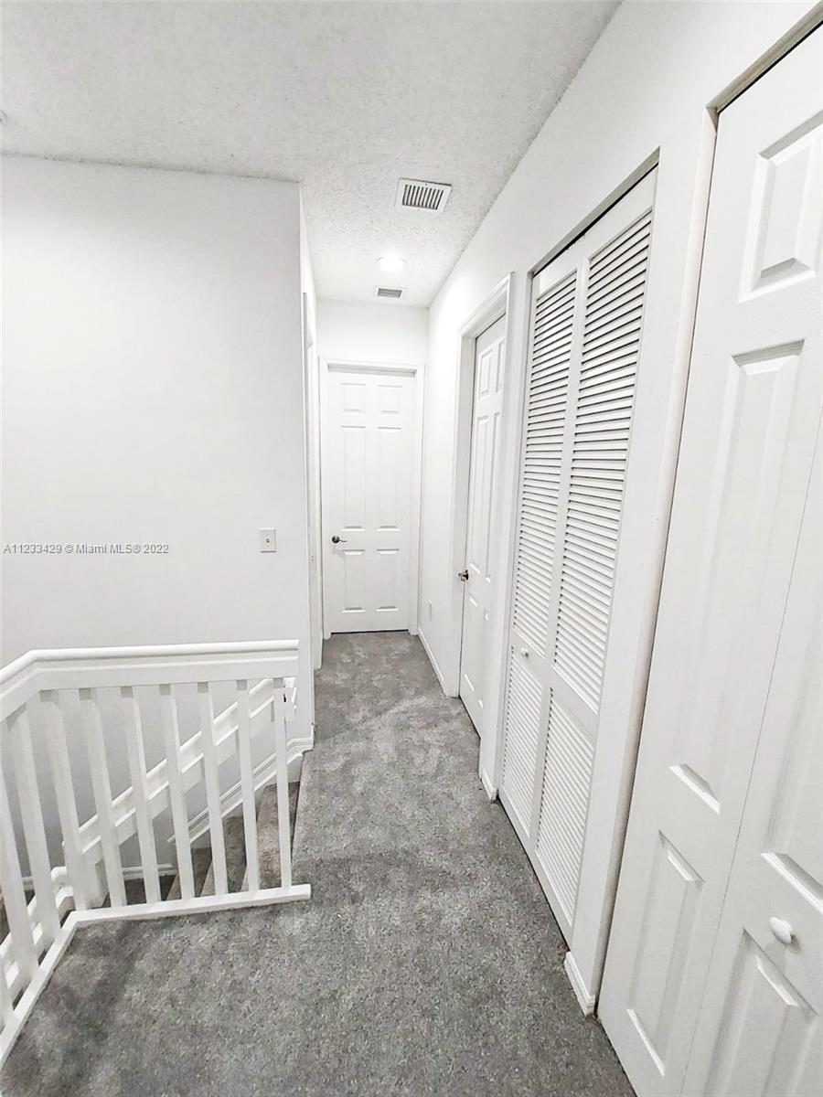 4282 Northeast 9th Street, Unit 4282 Homestead, FL 33033 - Photo 15 of 28 a view of a hallway with white walls