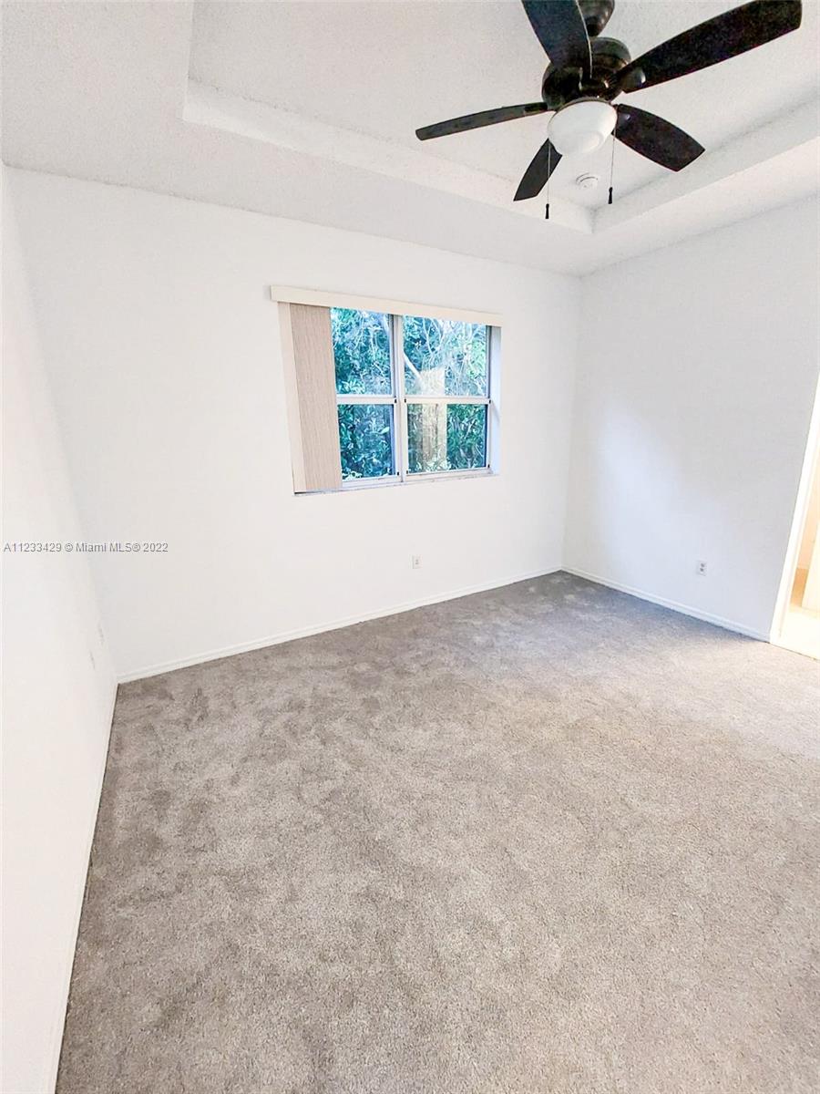 4282 Northeast 9th Street, Unit 4282 Homestead, FL 33033 - Photo 18 of 28 an empty room with windows