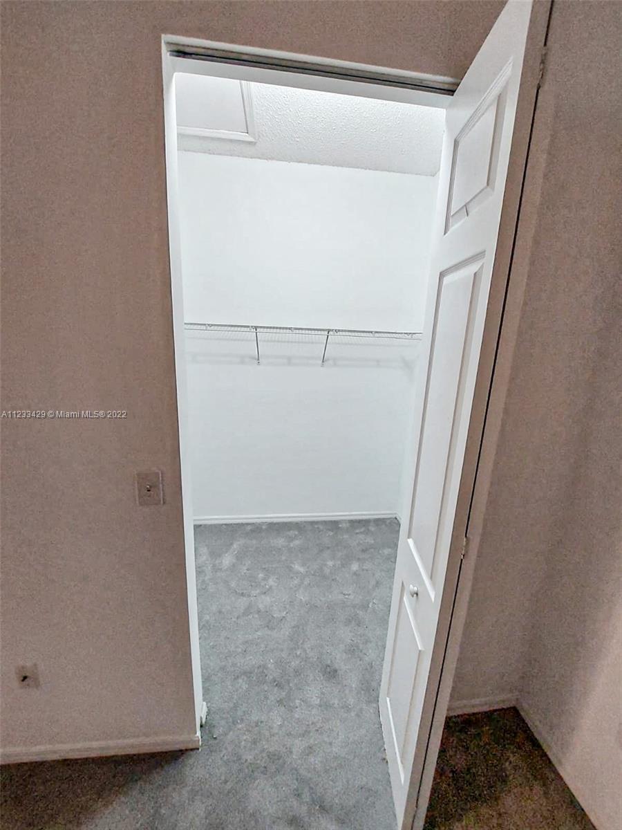 4282 Northeast 9th Street, Unit 4282 Homestead, FL 33033 - Photo 21 of 28 a view of walk in closet