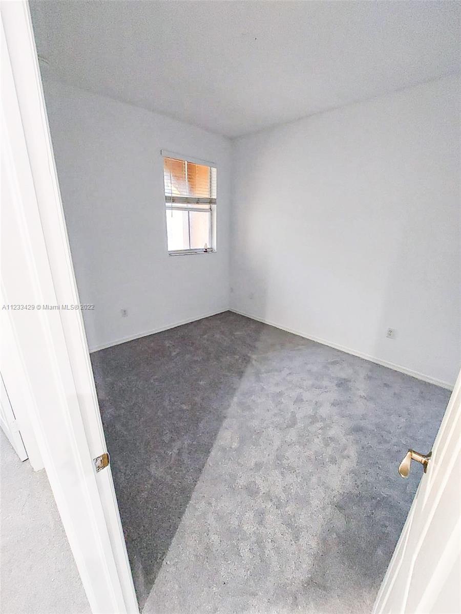 4282 Northeast 9th Street, Unit 4282 Homestead, FL 33033 - Photo 22 of 28 an empty room with windows