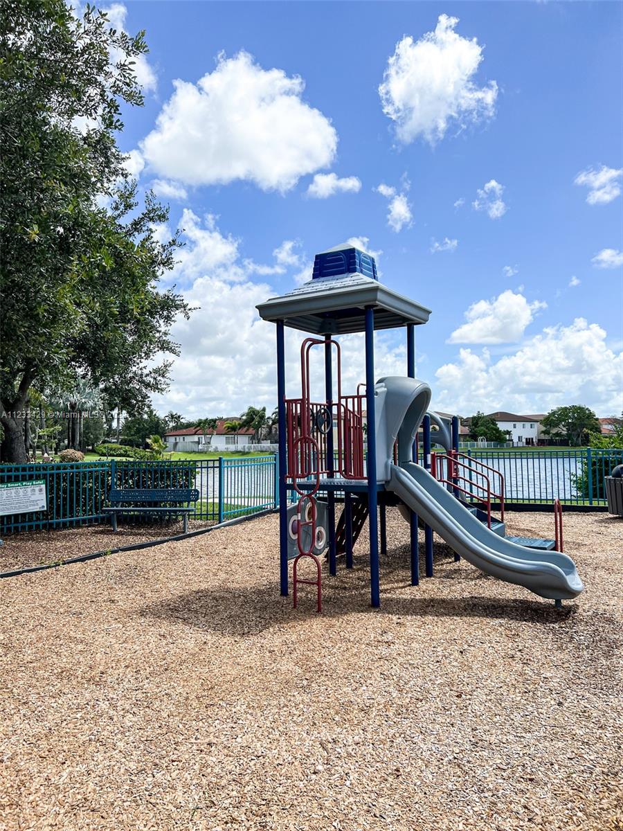 4282 Northeast 9th Street, Unit 4282 Homestead, FL 33033 - Photo 28 of 28 a view of a slide with a bench