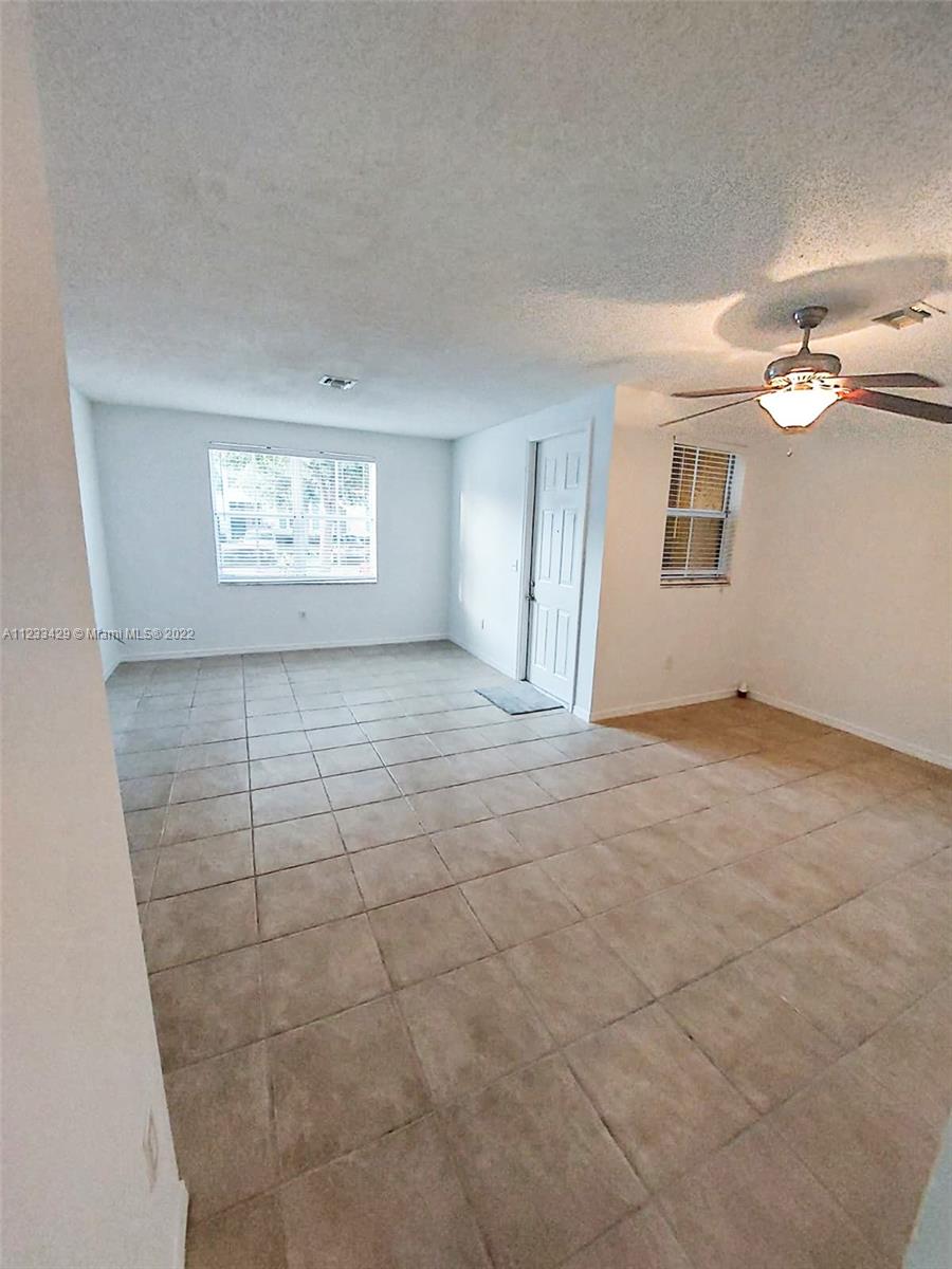 4282 Northeast 9th Street, Unit 4282 Homestead, FL 33033 - Photo 7 of 28 a view of an empty room with a window