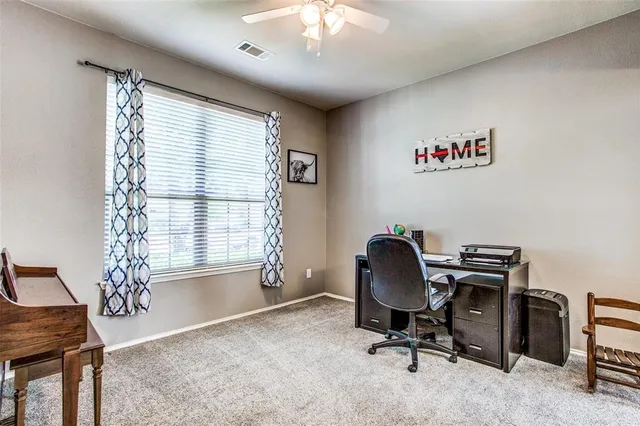 a workspace with furniture and a window